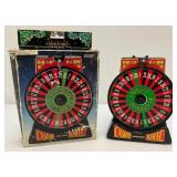 Miniature Criss 7 Cross Slot Machine Battery Operated 6" x 7 1/2" x 12 1/2" (Untested) And Casino Wheel With Original Box