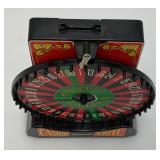 Miniature Criss 7 Cross Slot Machine Battery Operated 6" x 7 1/2" x 12 1/2" (Untested) And Casino Wheel With Original Box