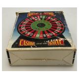 Miniature Criss 7 Cross Slot Machine Battery Operated 6" x 7 1/2" x 12 1/2" (Untested) And Casino Wheel With Original Box