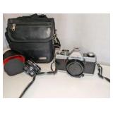 Minolta XG-7 35mm SLR film camera includes black carrying case, 2x auto tele converter