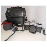 Minolta XG-7 35mm SLR film camera includes black carrying case, 2x auto tele converter