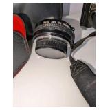Minolta XG-7 35mm SLR film camera includes black carrying case, 2x auto tele converter