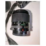 Vintage Canon AE-1 Program 35mm film SLR camera, Canon FD 100mm f/2.8 telephoto lens, Canon Speedlite 188A electronic flash unit