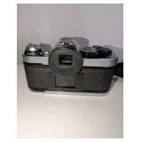 Vintage Canon AE-1 Program 35mm film SLR camera, Canon FD 100mm f/2.8 telephoto lens, Canon Speedlite 188A electronic flash unit