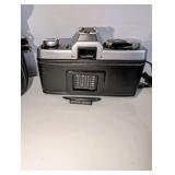 Minolta XG-7 35mm SLR film camera includes black carrying case, 2x auto tele converter