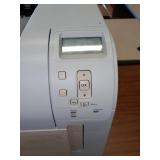 HP Laser Jet P4014N Printer and Desk.