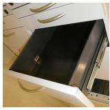 Four file cabinets (top is open)