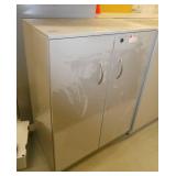 4 drawer file cabinet with a piece of desktop screwed to the top and a 2 door cabinet