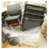 8 stacking chairs on wheels, 6 grey and 2 orange