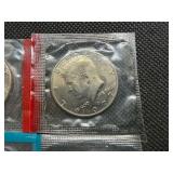 Four Kennedy Half Dollars Cut from Mint Package