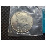 Four Kennedy Half Dollars Cut from Mint Package