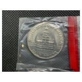 Four Kennedy Half Dollars Cut from Mint Package