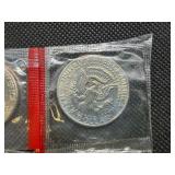 Four Kennedy Half Dollars Cut from Mint Package