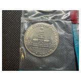 Four Kennedy Half Dollars Cut from Mint Package