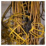 Lot of Extension Cords and Yellow Cage Work Lights