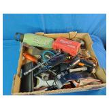 This box contains a mix of miscellaneous garage items, hand tools, small electronics, and personal care products.