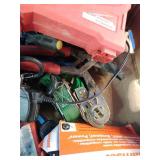 This box contains a mix of miscellaneous garage items, hand tools, small electronics, and personal care products.