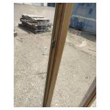 Vinyl sliding window features a desert sand color