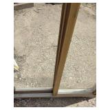 Vinyl sliding window features a desert sand color