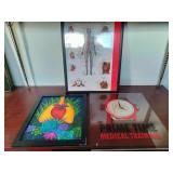 The framed art on the left features a stylized human heart surrounded by colorful succulent plants.