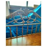 This French country-style bar console features a rich wood top and a decorative wrought iron frame
