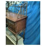 This French country-style bar console features a rich wood top and a decorative wrought iron frame