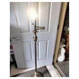 Vintage brass floor lamp appears to be a Underwriters Laboratories swing arm model featuring an ornate stem design