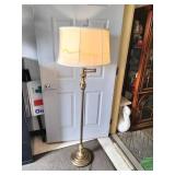 Vintage brass floor lamp appears to be a Underwriters Laboratories swing arm model featuring an ornate stem design