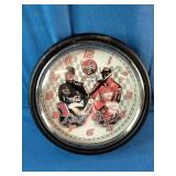 This vintage Coca-Cola NASCAR Dale Earnhardt Sr. and Jr. wall clock features signature branding and a glass lens.