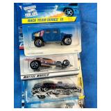 Collection of vintage carded Hot Wheels die-cast toy cars, primarily from the mid-to-late 1990s.