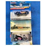 Assortment of vintage sealed Hot Wheels die-cast cars from the late 1990s and early 2000s,