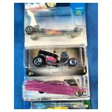 This collection contains a variety of vintage and specialized Mattel Hot Wheels carded die-cast cars spanning from the late 1990s through the mid-2000s.