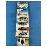 Stacked collection of vintage Mattel Hot Wheels die-cast vehicles
