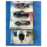Stacked collection of vintage Mattel Hot Wheels die-cast vehicles