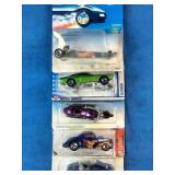 Stacked collection of vintage Mattel Hot Wheels die-cast vehicles