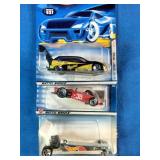 Six classic Mattel Hot Wheels carded die-cast cars.