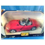 Pair of vintage die-cast vehicle collectibles in their original window display boxes.