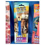Three vintage, carded PEZ candy dispensers from different classic sets still sealed in their original blister packs: