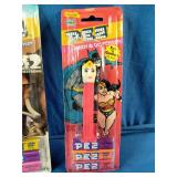 Three vintage, carded PEZ candy dispensers from different classic sets still sealed in their original blister packs: