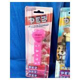 Three vintage, carded PEZ candy dispensers from different classic sets still sealed in their original blister packs: