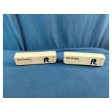 Two N scale or HO scale model railroad boxcars, specifically representing the Rock Island "Route Rock" scheme