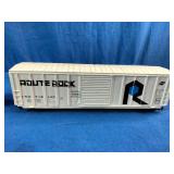 Two N scale or HO scale model railroad boxcars, specifically representing the Rock Island "Route Rock" scheme