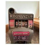 Vintage Bonanza Bank Slot Machine Coin Bank Gray Pink Countertop