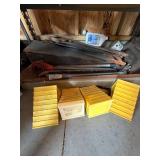 Box Lot of Assorted Pry Bars, Hand Saws & Plastic Wheel Chocks