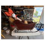 Vintage-Style Woven Wicker Christmas Sleigh with Birch Logs and Decor