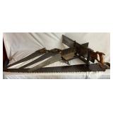 Three Antique E.C. Atkins Handsaws, 1 Disston Antique Saw, 1 Vintage 27' Disston Saw in Miter Box