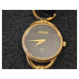 Gucci Ladies Wrist Watch with Gold Plated Case and Black Textured Leather Strap