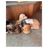 Doll Head, Praying Hands, Dog Yard Statue