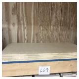 Stack of Unfinished Wood Panels