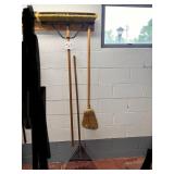 Brooms and rake